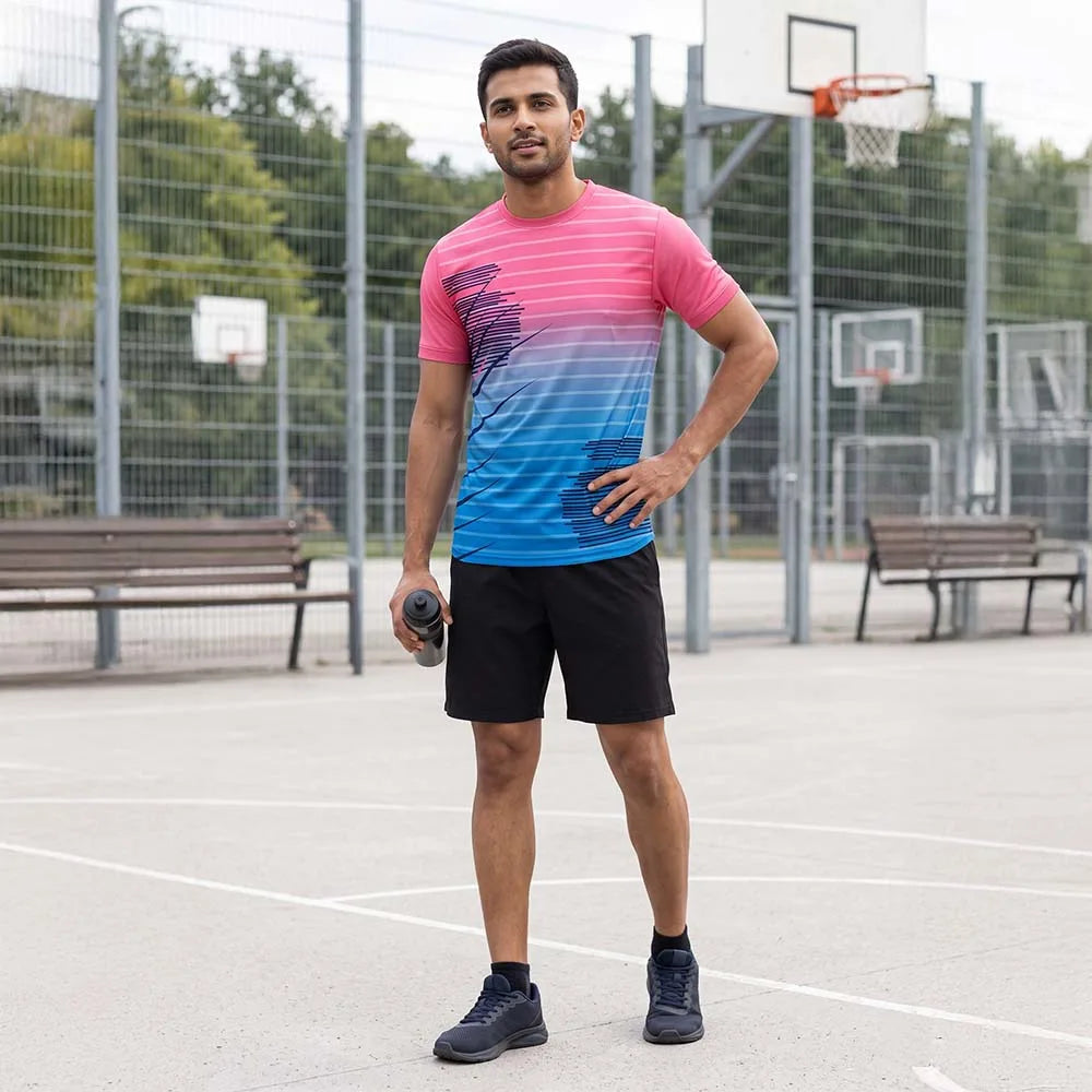 Man on a basketball court wearing a pink-to-blue gradient round-neck jersey with pinstripes and black shorts