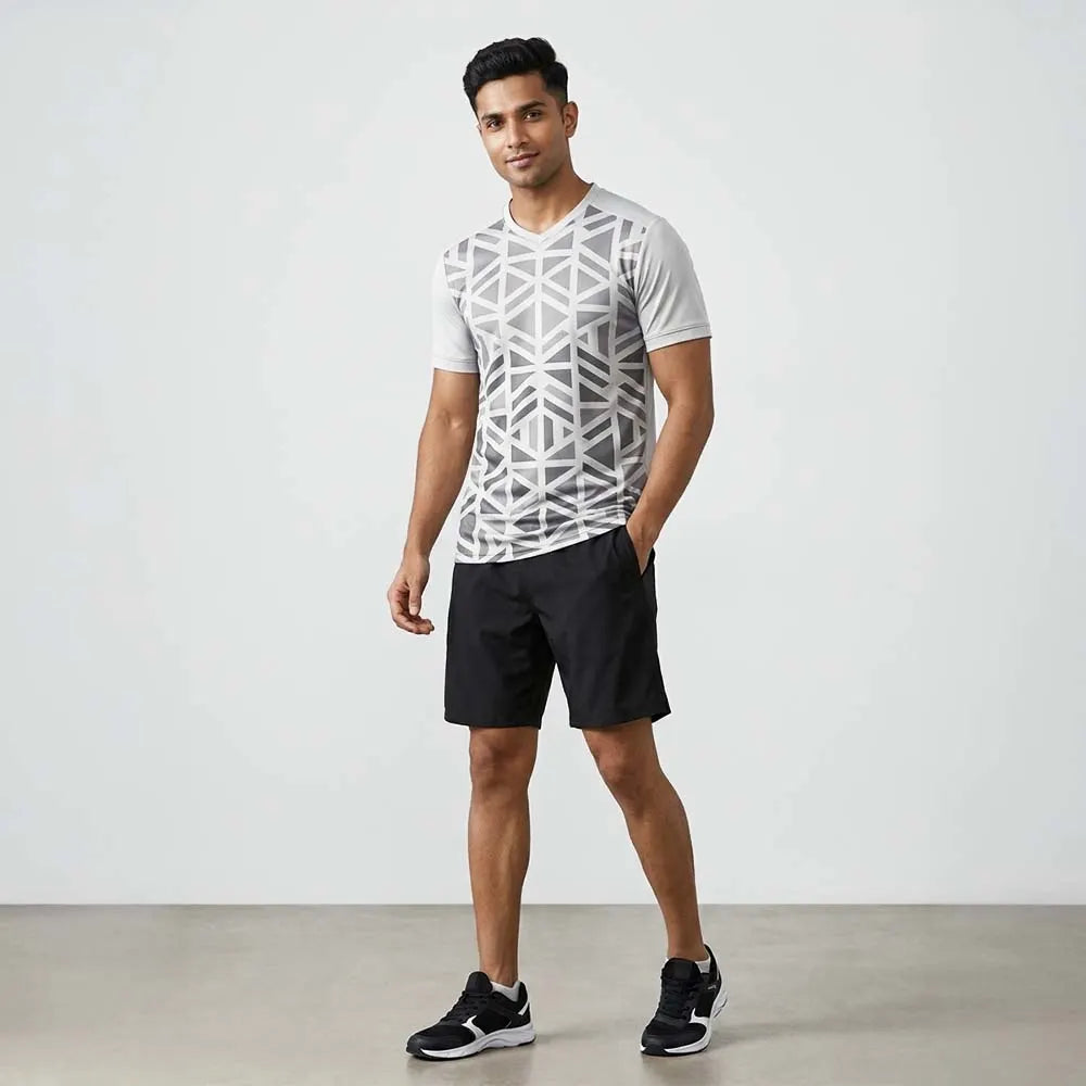 Model wearing Grey Geo geometric grey V-neck jersey and black shorts