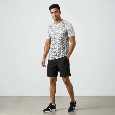Model wearing Grey Geo geometric grey V-neck jersey and black shorts
