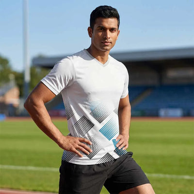 Model wearing Blue Motion blue geometric V-neck jersey and black shorts