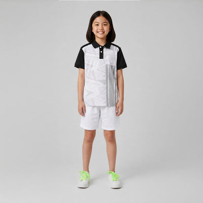 Kids model wearing black white geometric jersey and white shorts set