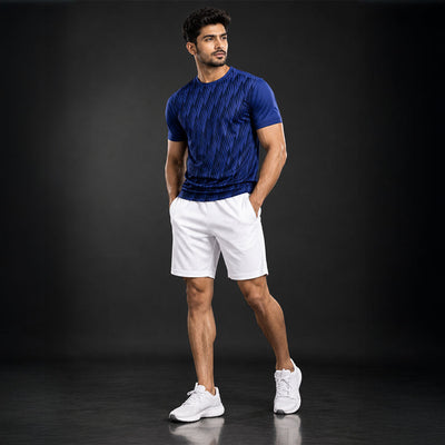 Model wearing navy jersey and white shorts set