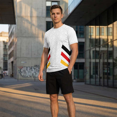 Model wearing white tricolor jersey and black shorts set