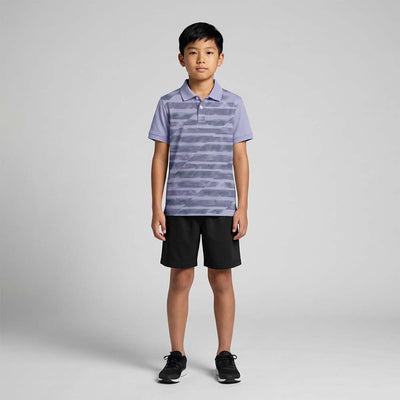 Kids' polo sports jersey in lavender grey with dark horizontal graphic stripes, worn by a child in black shorts standing in a studio.