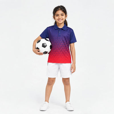 Child wearing the navy-to-red dotted gradient polo jersey with white shorts, holding a football.