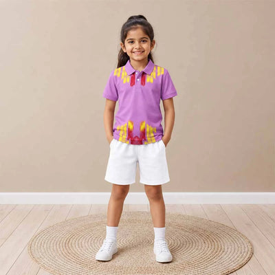 Child wearing a lilac with yellow and red flame-like graphics polo jersey and white shorts, standing indoors.
